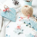 Handmade ceramic Christmas decorations on white wooden table