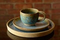 A handmade ceramic cup set, painted in blue stained with beige tones, ready to receive a very hot and tasty tea or coffee. In the Royalty Free Stock Photo