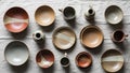 Of handmade ceramic tableware is arranged on a textured light Royalty Free Stock Photo
