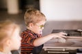 Handmade Ceramics: 5-Year-Old Boy with Glasses Exploring Art Royalty Free Stock Photo