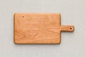 Handmade cherry wood wooden chopping board on sackcloth. Cherrywood wooden pallet. Cherry wood plank natural texture background.