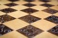 Handmade chessboard, close-up, side view, beautiful drawing on wood