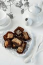 Handmade chocolate covered with cocoa and nut crumbs. Still life with sweets and tea appliances Royalty Free Stock Photo