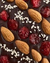 Handmade chocolate bar filled with almonds, cherries and sesame seeds.