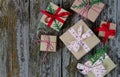 Handmade christmas gift boxes top view on rustic wooden background Royalty Free Stock Photo