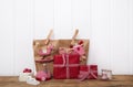 Handmade christmas presents wrapped in red paper with checked ri Royalty Free Stock Photo