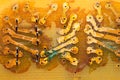 Handmade circuit board with copper tracks. industrial background. textolite with soldering