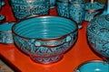 Handmade clay dishes in the Greek style in the shop at the potter`s workshop