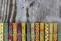 Handmade clothespins in a wood background Royalty Free Stock Photo