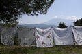 Handmade cloths hanging on washing line in countryside, Albania