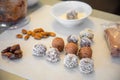 Handmade coconut snow balls made from dates, almond and coconut truffles on grey surface Royalty Free Stock Photo