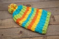 Handmade colored wool knitted winter hat and scarf Royalty Free Stock Photo