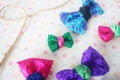 Handmade colorful bow tie on white fabric