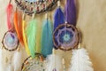 Closeup colorful dreamcatcher details on striped craft wrapping paper background