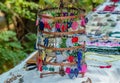 Handmade colorful earrings on a stand