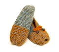 Handmade colorful knitted wool slippers on a white background