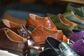 Handmade colorful luxury man shoes in a factory.