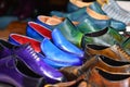 Handmade colorful luxury man shoes in a factory.