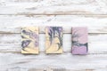 Handmade colorful soaps on wooden table background. Zero waste concept