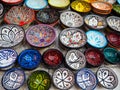 Handmade colourful decorated bowls or cups on display at traditional souk - street market in Morocco Royalty Free Stock Photo