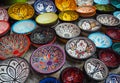 Handmade colourful decorated bowls or cups on display at traditional souk - street market in Morocco Royalty Free Stock Photo