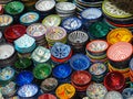 Handmade colourful decorated bowls or cups on display at traditional souk - street market in Morocco Royalty Free Stock Photo