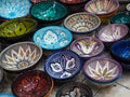 Handmade colourful decorated bowls or cups on display at traditional souk - street market in Morocco Royalty Free Stock Photo