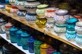 Handmade colourful decorated bowls or cups on display at traditional souk - street market in Morocco Royalty Free Stock Photo