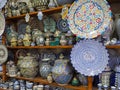 Handmade colourful decorated bowls, plates and cups on display at traditional souk - street market in Morocco Royalty Free Stock Photo