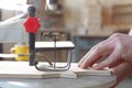 Handmade and craft concept. Carpenter engaged in processing wood at the sawmill. Royalty Free Stock Photo