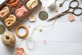 Handmade crafts workspace with yarn threads scissors and crochet hooks on a rustic white table perfect for DIY projects creative Royalty Free Stock Photo