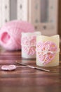 Handmade crochet pink heart on candle for Saint Valentine's day