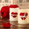 Handmade crochet red heart on candle with skein for Saint Valent Royalty Free Stock Photo