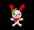Handmade crochet white rabbit with red ear doll on Royalty Free Stock Photo
