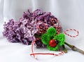 Handmade crocheted basket with red and white string, known as Martisor.