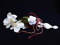 Handmade crocheted basket with spring flowers and red and white string, known as Martisor. Royalty Free Stock Photo