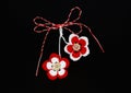 Handmade crocheted flowers with red and white string, known as Martisor. Royalty Free Stock Photo