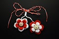 Handmade crocheted flowers with red and white string, known as Martisor. Royalty Free Stock Photo
