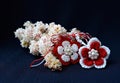 Handmade crocheted flowers with red and white string, known as Martisor. Royalty Free Stock Photo