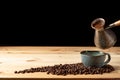 Handmade cup with coffee on the table