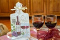 Handmade decoration on a wooden board and glasses wine