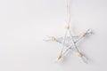 Handmade decorative star of wooden sticks on a white background with copy space. Christmas decorations Royalty Free Stock Photo