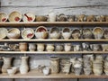 Handmade different clay dish on shelf, Lithuania Royalty Free Stock Photo