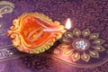 Handmade Diwali Clay Lamp on Floral Background