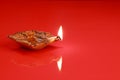 Handmade Diwali Clay Lamp on Red Color Background Royalty Free Stock Photo