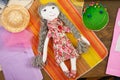 Handmade doll, sewing accessories top view, seamstress workplace, many object for needlework, embroidery, handmade and handicraft