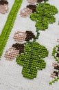 Handmade embroidery by cross stitch. Royalty Free Stock Photo