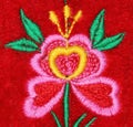 Handmade embroidery flower on red velvet Royalty Free Stock Photo