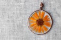 Handmade epoxy resin jewelry. pendant. calendula officinalis flower in copper frame