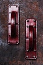 Handmade exclusive red leather door handles in the shape of the handle of a vintage suitcase Royalty Free Stock Photo